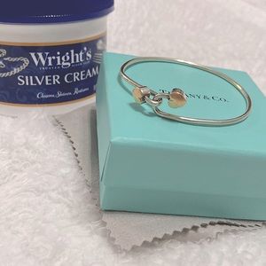 Tiffany and Co. 18k yellow gold and silver double heart bangle